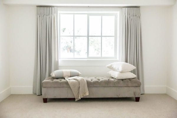 Elegant blackout drapery in a hotel room by Workroom by Design, Hardware